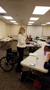 Heather standing and leading the meeting!