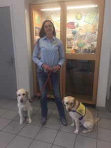 Melissa and two assistance dogs