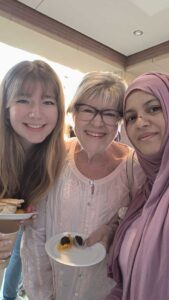 Erin, Georgia, and Rizwana enjoying the reception.