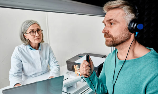 A man getting a hearing screening