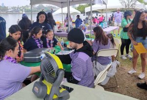 Face painters busy at their table.