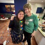 Alicia and Anna posing at the party