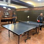 Two people enjoying ping pong