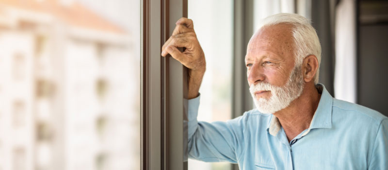 Man staring out a window