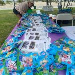 Hasbro figurines laid out on a table before Walk4Hearing