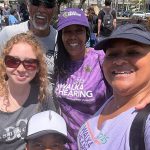 Walk4Hearing participants smiling at the camera